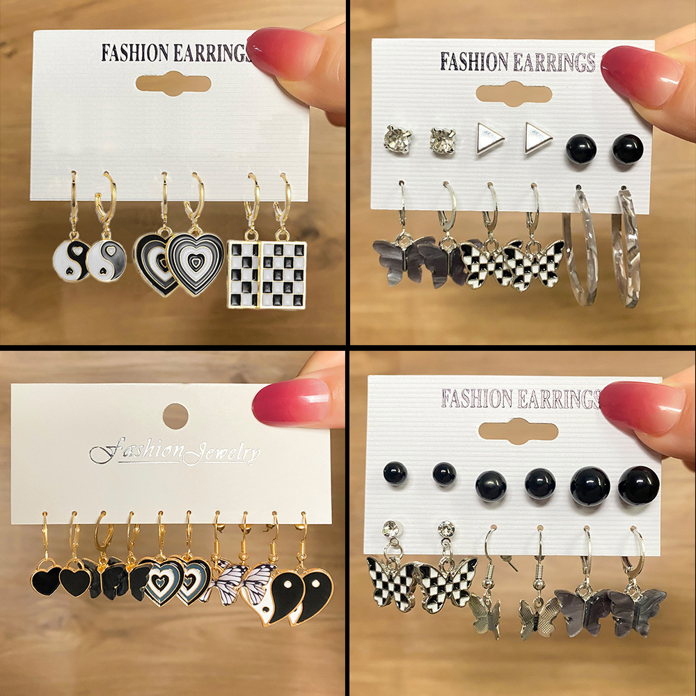 Wholesale of new acetic acid butterfly pendant earrings, creative Tai Chi heart earrings and black oil-dropping ear buckles for European and American foreign trade full figure