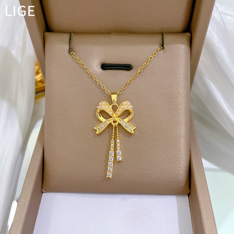 【 Titanium Steel 】 Necklace and earring set, light luxury full diamond bow tassels, personalized and elegant banquet earrings and necklaces Specification drawing