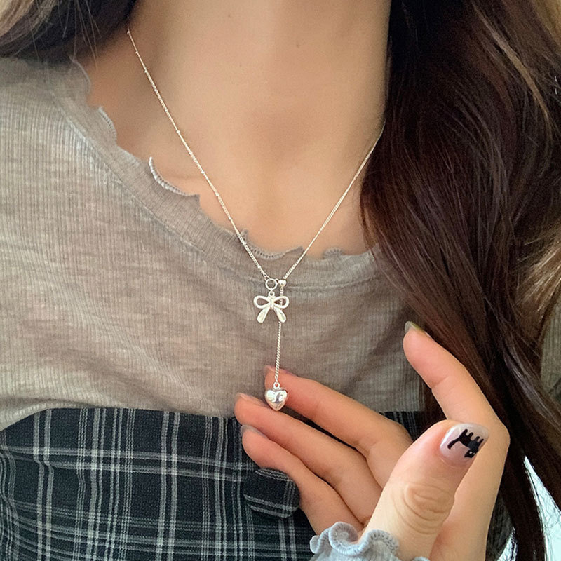 A design sense bow heart pull-out adjustable necklace for women, simple and elegant, light luxury, versatile neckchain, collarbone chain full figure
