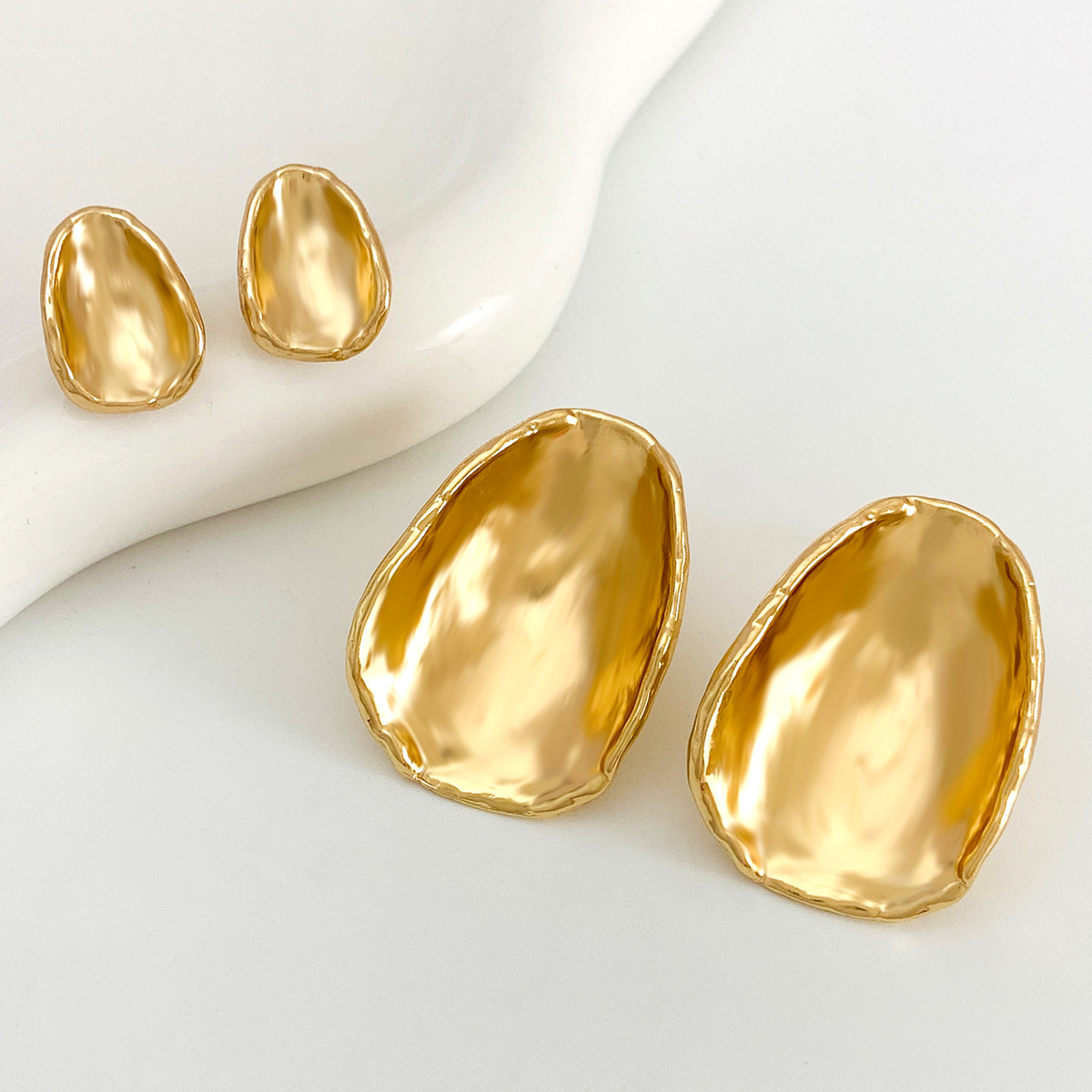 European and American InS-style irregular round piece earrings, French light luxury and niche design, textured ear studs, cross-border earrings Application Scenario