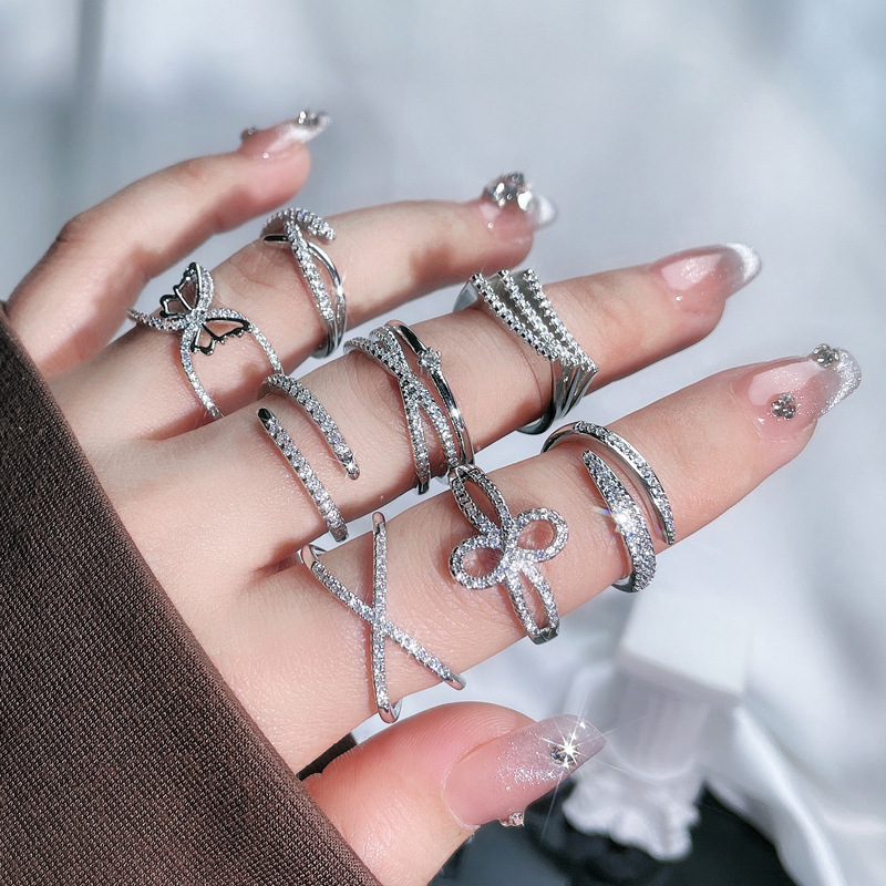 This niche design with slightly inlaid lines and a simple open ring is a versatile and stylish accessory for women. It can be worn in layers and exudes a cool and trendy vibe full figure