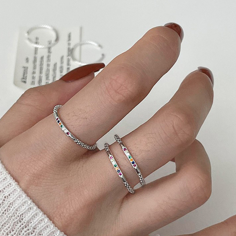 The small colored diamond zircon rainbow open ring is a unique design for women, with a high-end and individual style. It can be stacked to make the hand look slender and simple full figure