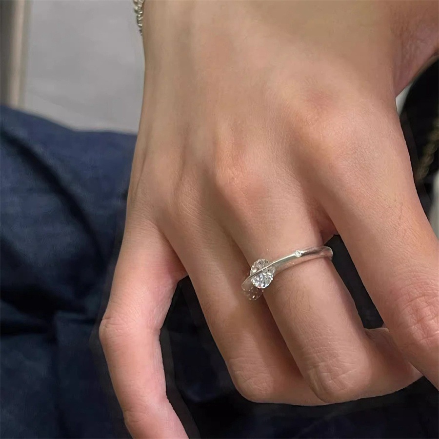 A rare and unique female design of a rotating zircon planet ring with a sparkling diamond opening Item Picture