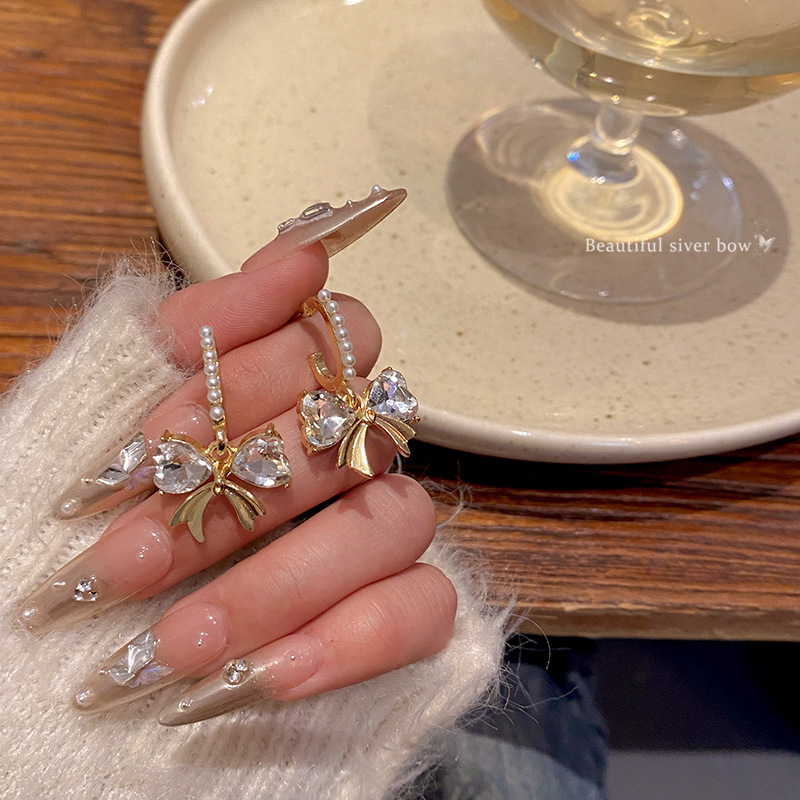 Dongdaemun, South Korea, bow-shaped zircon earrings, women's fashionable and high-end earrings, elegant diamond-encamed long earrings wholesale Specification drawing