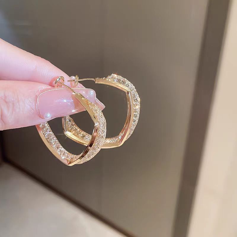 Golden earrings, a light luxury and niche design for women, double-layer high-end zircon stud earrings, a cool and elegant style, exaggerated earrings Specification drawing