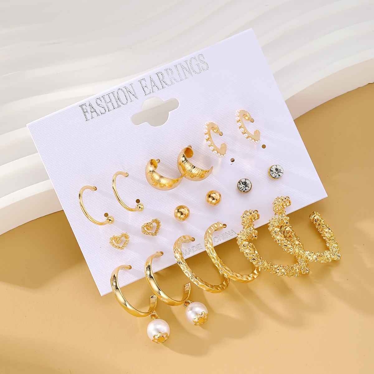 European and American cross-border best-selling retro exaggerated women 's heart-shaped stud twisted pearl earrings 9-piece set earrings Specification drawing