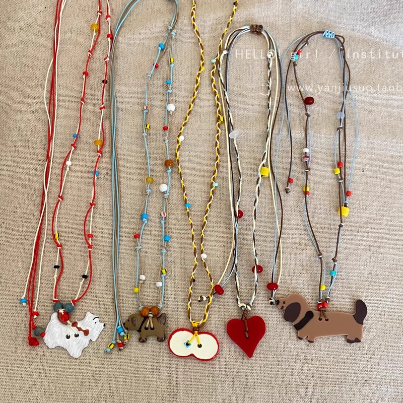 Cute and adorable apple heart-shaped puppy pendant necklace for women, colorful, fashionable and versatile long braided rope collarbone chain details Picture