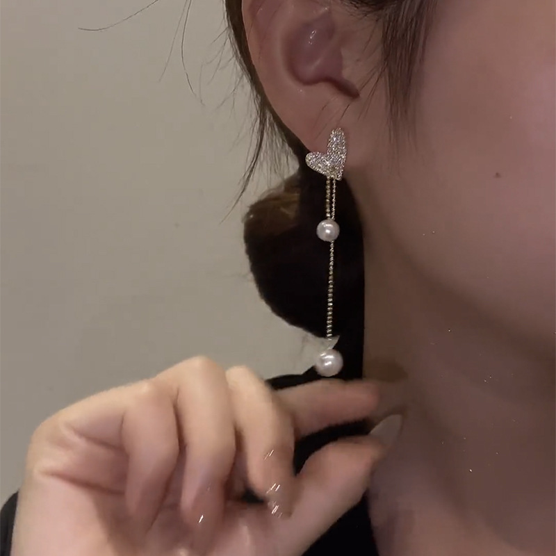 Heart-shaped pull-out pearl tassel earrings, female Internet celebrity, light luxury and high-end silver needle stud earrings wholesale, ins women's earrings Specification drawing