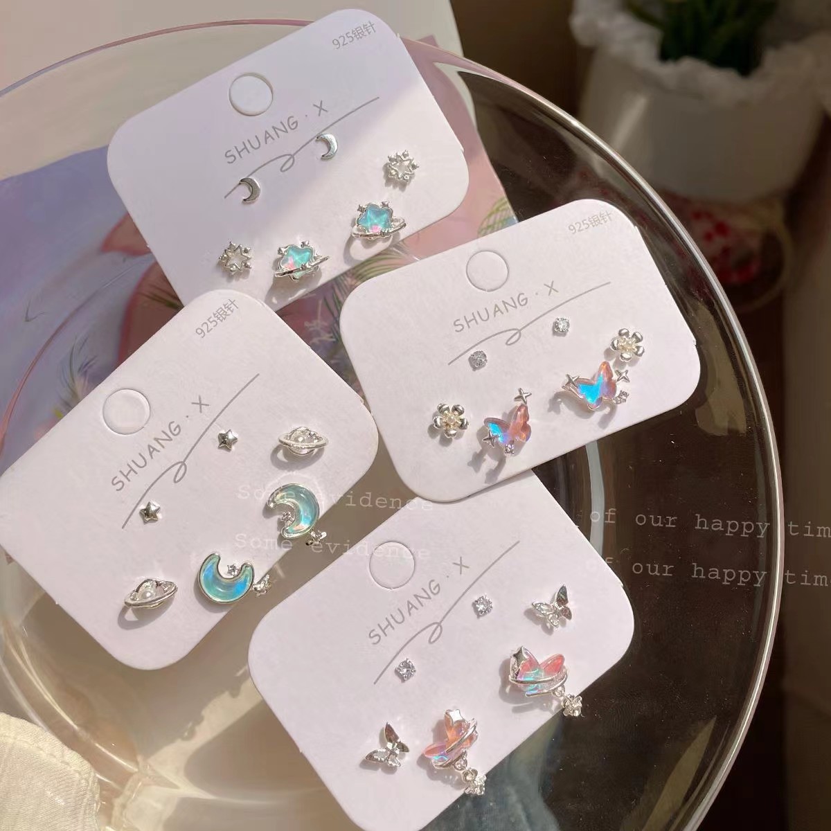 Sweet and cool, dazzling laser aurora moon stud earrings set for women, silver needle, simple and niche star earrings wholesale in Yiwu full figure