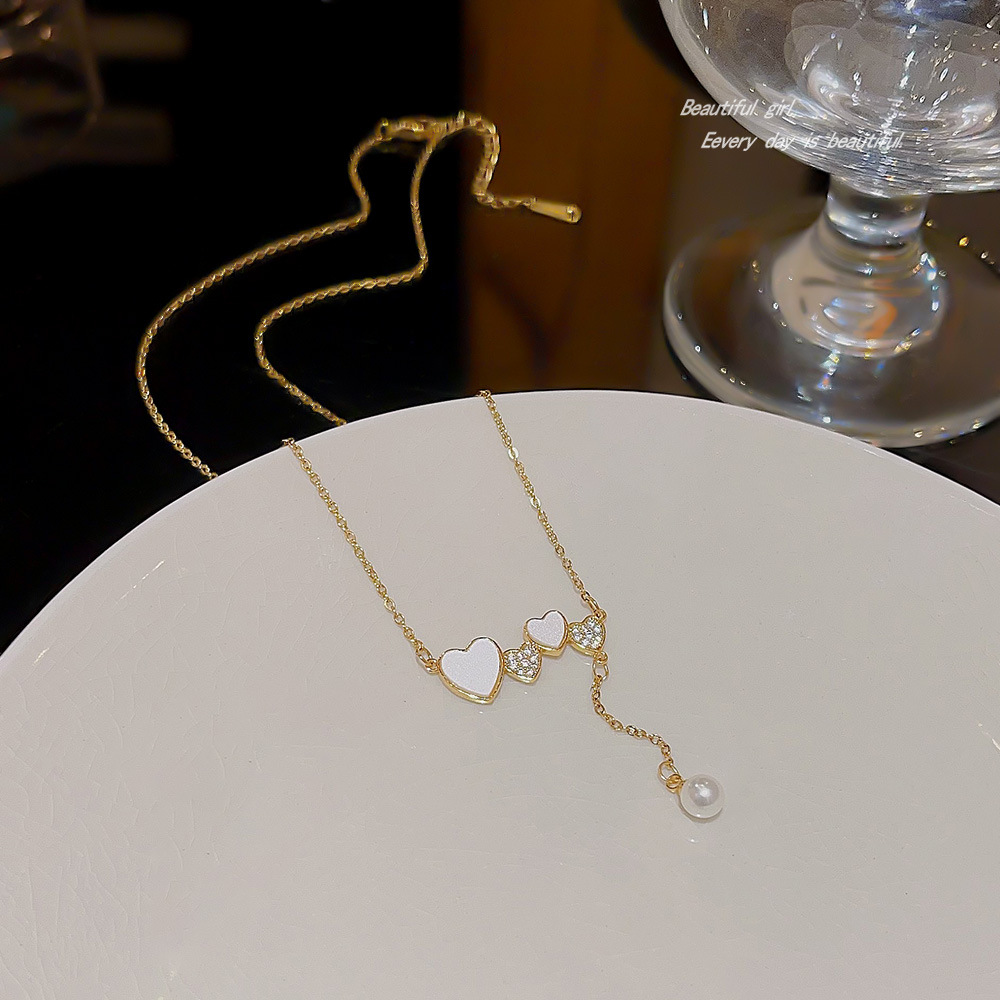 Elegant heart-shaped pearl necklace, high-end design sense, versatile heart pendant, simple student accessory, titanium steel collarbone chain details Picture