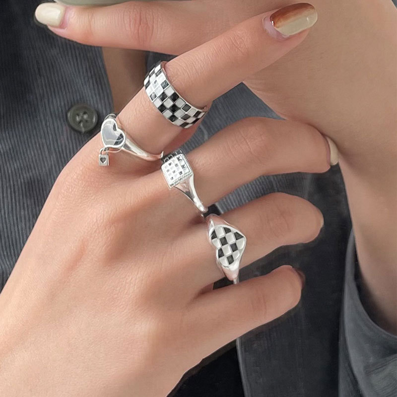 A Korean version of a niche design black and white checkered pattern combination ring, a retro and high-end fashion ring with an ins style for women details Picture
