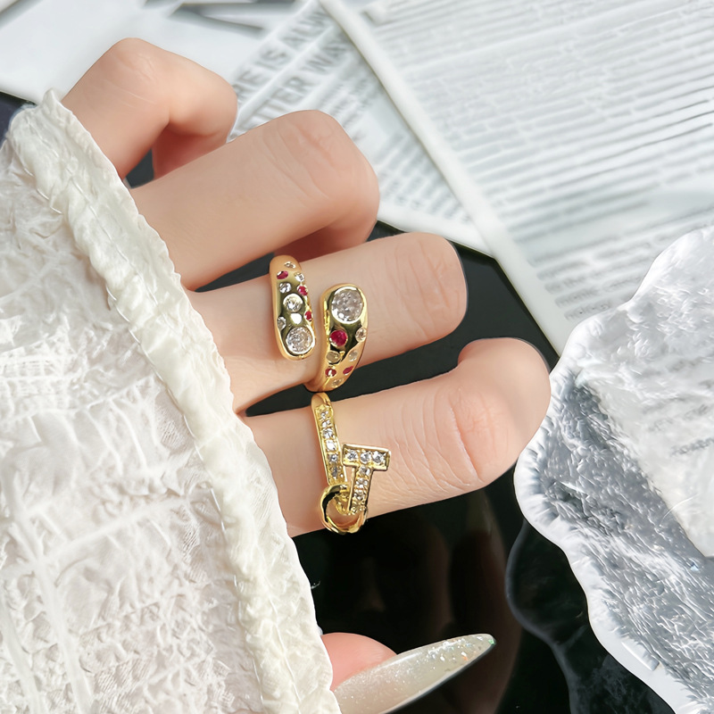 A retro, light luxury diamond-encrusted ring for women, with a simple, niche and unique design sense. The T-shaped cross design exudes a unique and individualistic style. The ring is layered and worn details Picture