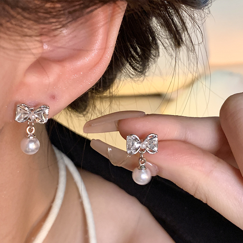 S925 Silver Needle Bow Pearl Earrings, a versatile and high-end summer trendy and popular ear accessory wholesale details Picture