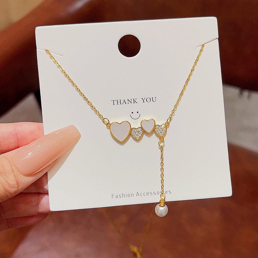 Elegant heart-shaped pearl necklace, high-end design sense, versatile heart pendant, simple student accessory, titanium steel collarbone chain Specification drawing