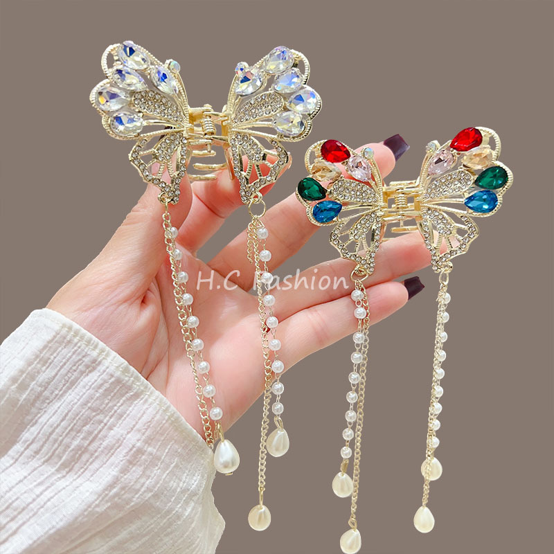 A new exquisite and niche female half-tied hair clip with a shark clip on the back of the head, featuring a butterfly pearl tassel full figure