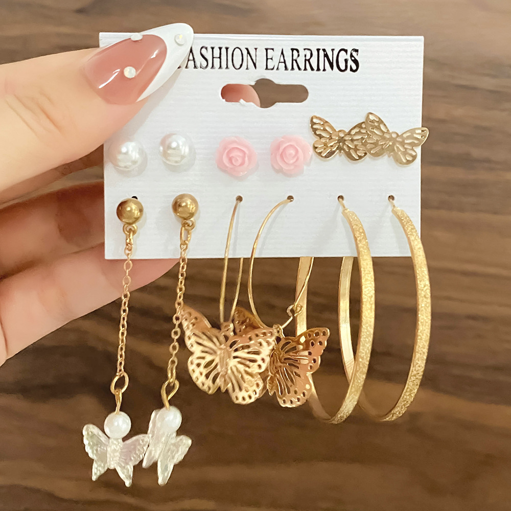 European and American cross-border long tassel butterfly earrings, asymmetrical alloy pearl butterfly pendant earrings, card earrings details Picture