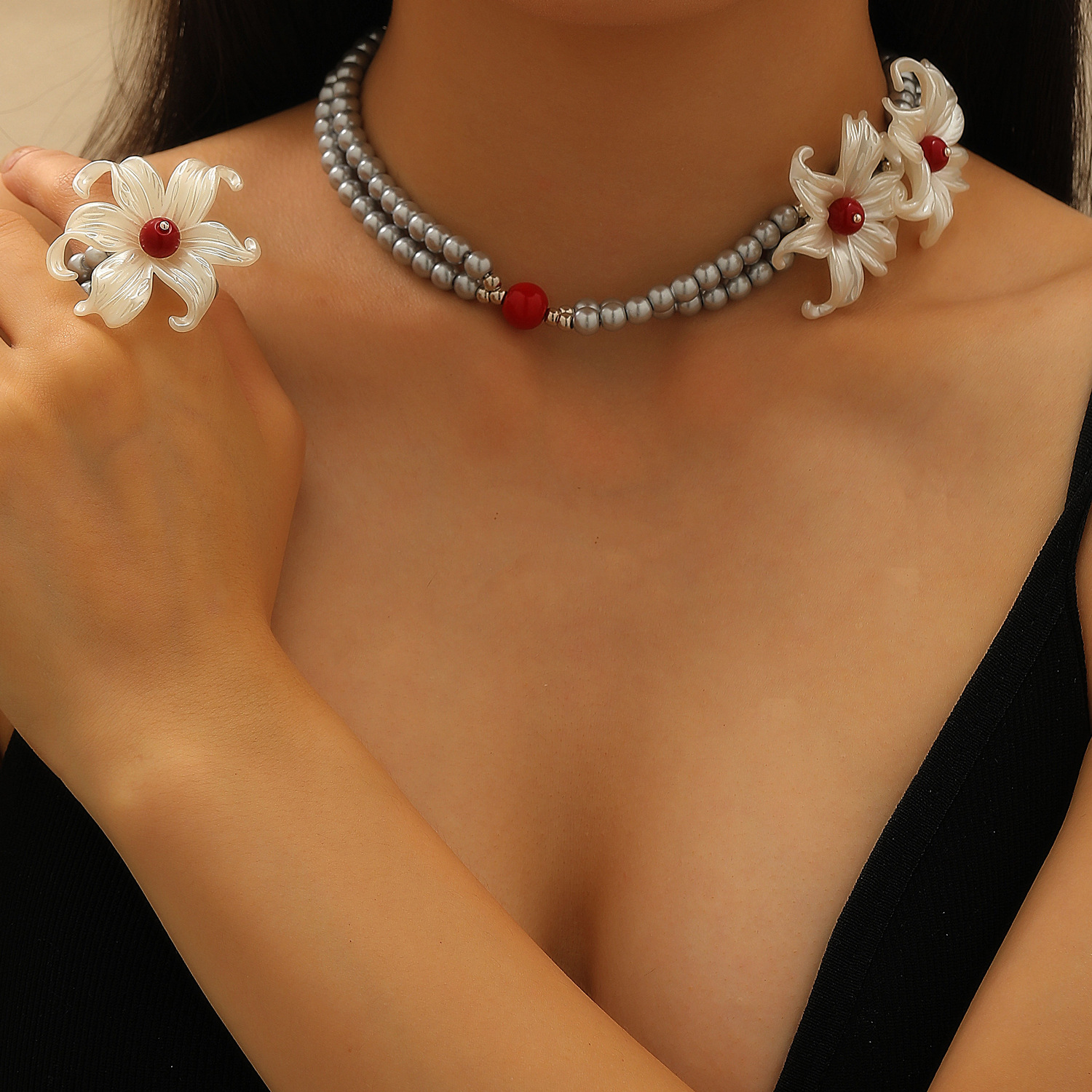 A unique design of iris flower silver pearl necklace with floral embellishments on the neck, a men's same style and a women's choker collarbone chain ring details Picture