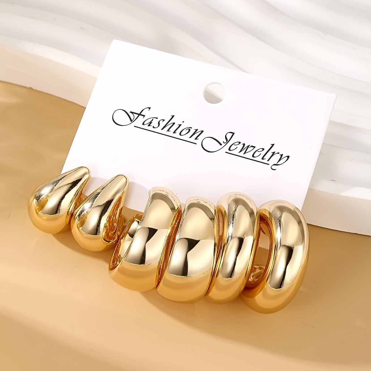 A new set of 3-piece golden metal earrings with a high-end, creative, retro and simple style from Europe and America, featuring Doudou stud earrings details Picture