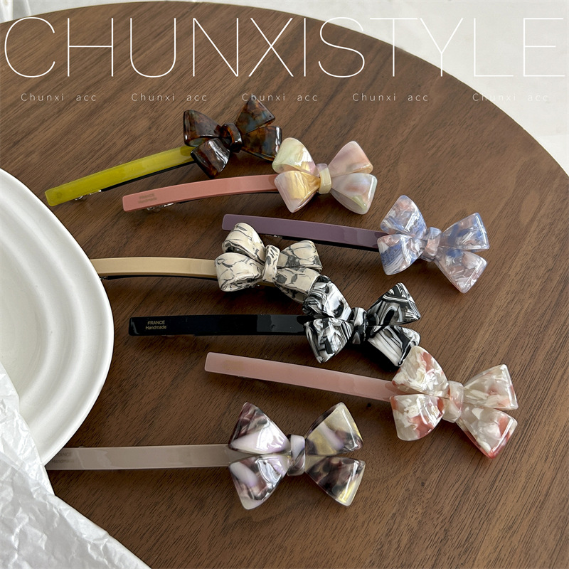 Korean style acetic acid bow hair clip, women's back head updo one-line clip, popular 2023 new spring clip Application Scenario