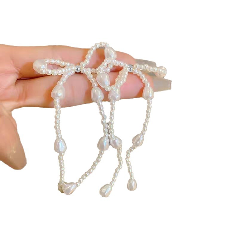 Pearl bow stud earrings, a new bestseller in 2025, are long tassel earrings with a light luxury, niche and high-end design Item Picture