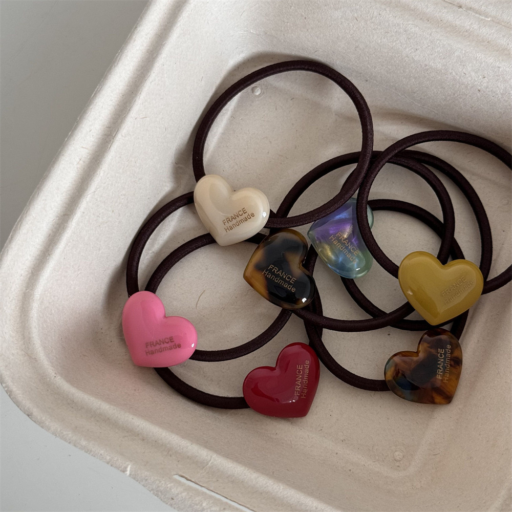 Gold label heart-shaped acetate candy-colored hair band, high-elasticity rubber band, cute and sweet, high ponytail hair tie Application Scenario