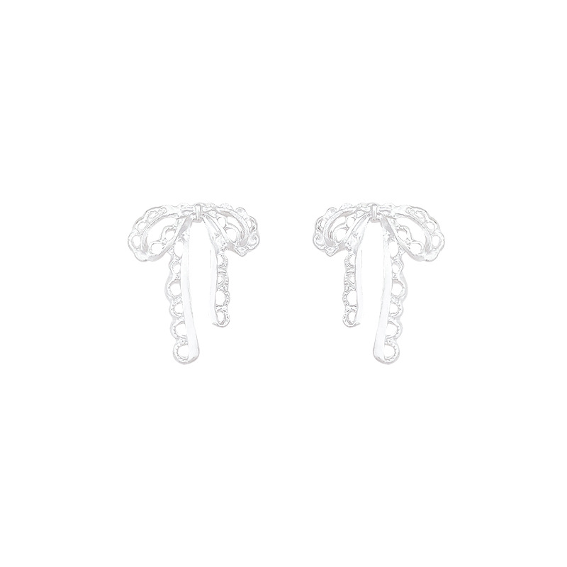 Hollowed-out ribbon bow earrings for women, with a light luxury, niche and high-end feel, versatile and elegant. Tassel ear studs are best-selling earrings Item Picture