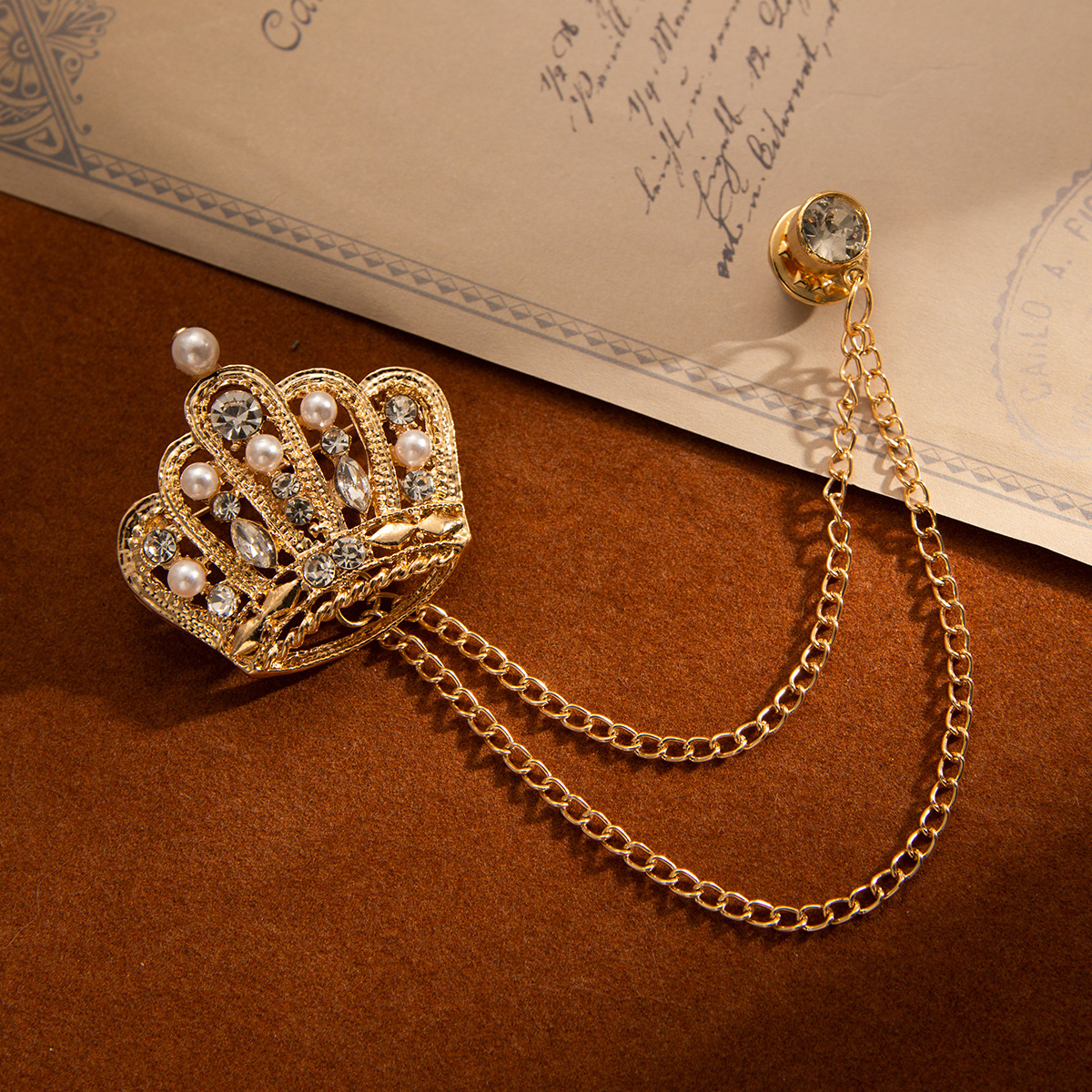 Wholesale of European and American retro crown tassel chain fashion brooches, formal wear, light luxury and high-end rhinestone accessories and brooches details Picture