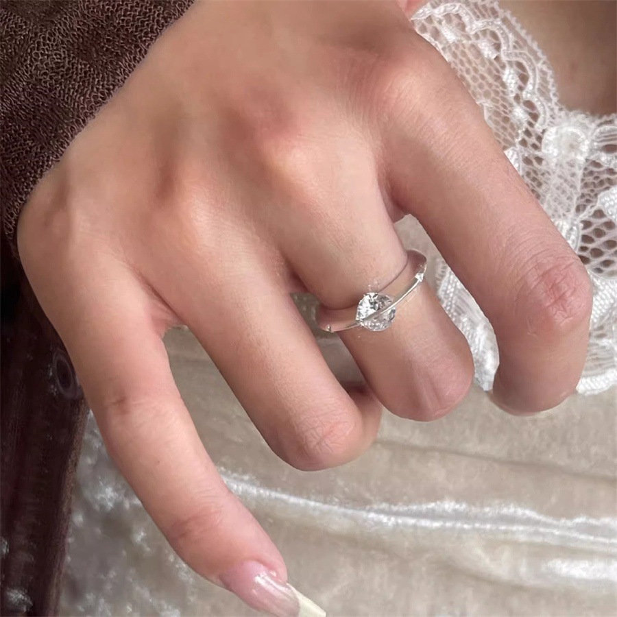 A rare and unique female design of a rotating zircon planet ring with a sparkling diamond opening Application Scenario