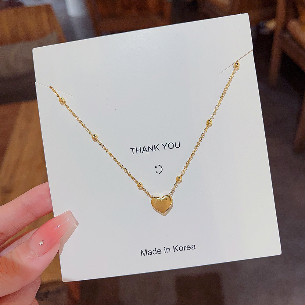 A Japanese and Korean style titanium steel non-fading heart-shaped necklace for women, a light luxury and niche hot girl sweater, a glass bead chain, a winter bestseller necklace Specification drawing
