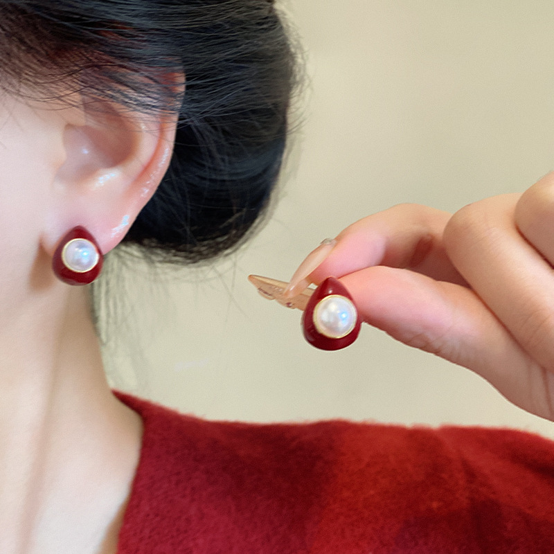 Autumn and winter red teardrop pearl stud earrings for women, versatile, niche and high-end style earrings, retro charm, New Year's earrings wholesale details Picture