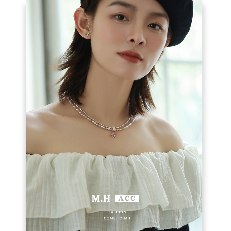 The new purple butterfly zircon pearl necklace is simple, elegant and high-end. It features a double-layered collarbone chain for women full figure
