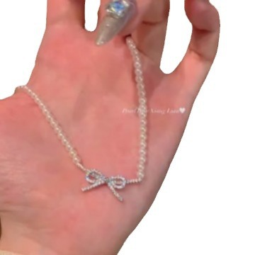 Wholesale of 2024 new style pearl bow necklace with a light luxury and niche design sense, sweet collarbone chain Item Picture