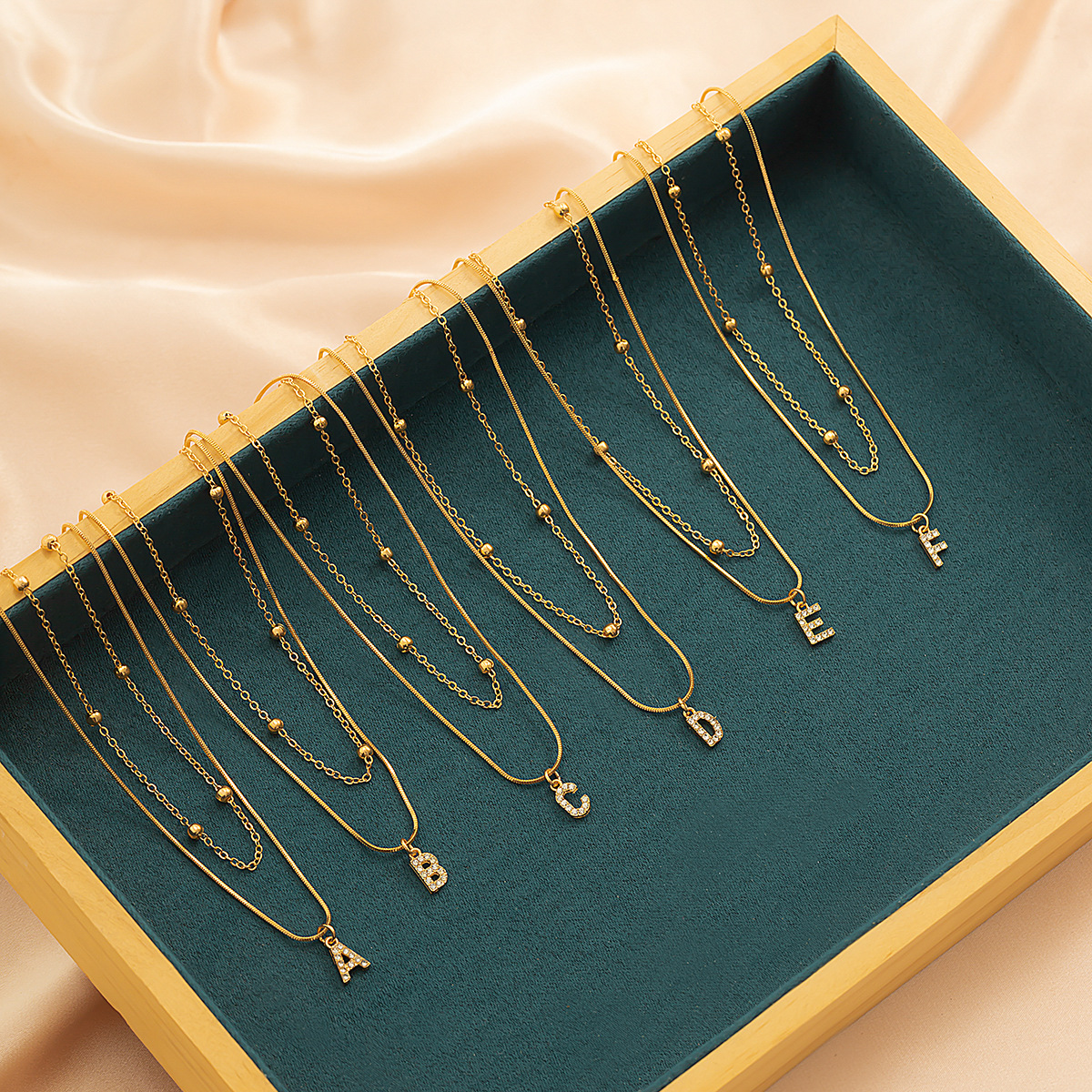 European and American cross-border simple diamond-encruted English letter pendant, double layer necklace collarbone chain, versatile snake bone necklace for women Application Scenario