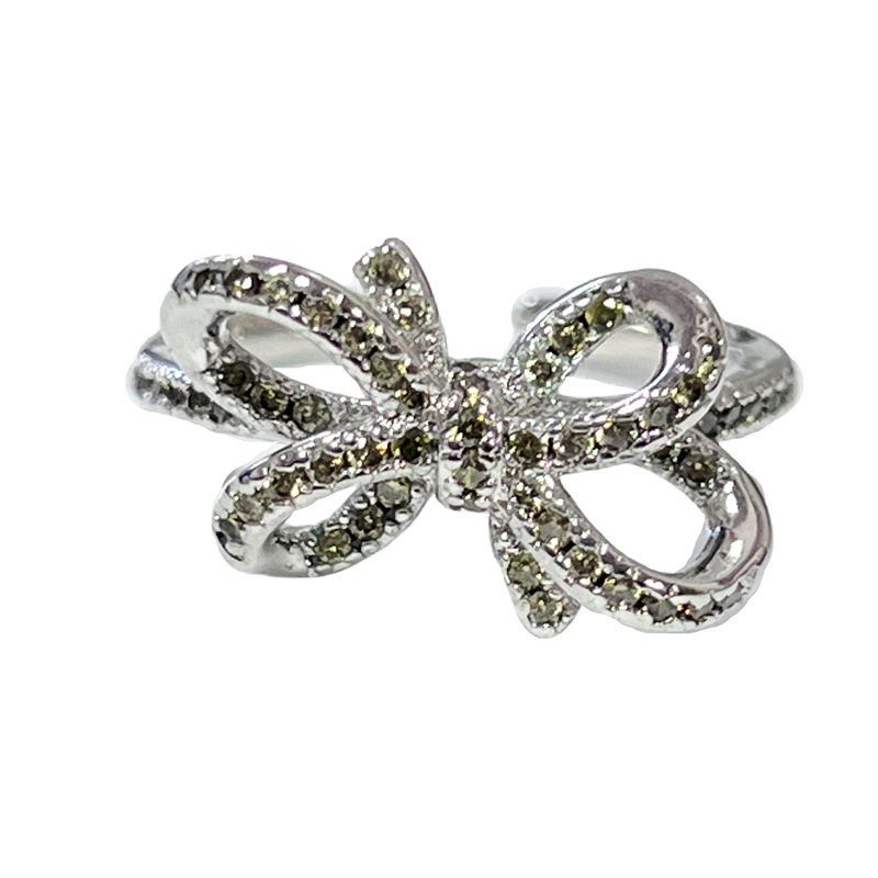 A new minimalist olive green diamond bow ring for women with a geometric irregular star-shaped design, exuding a sense of light luxury and sophistication Item Picture