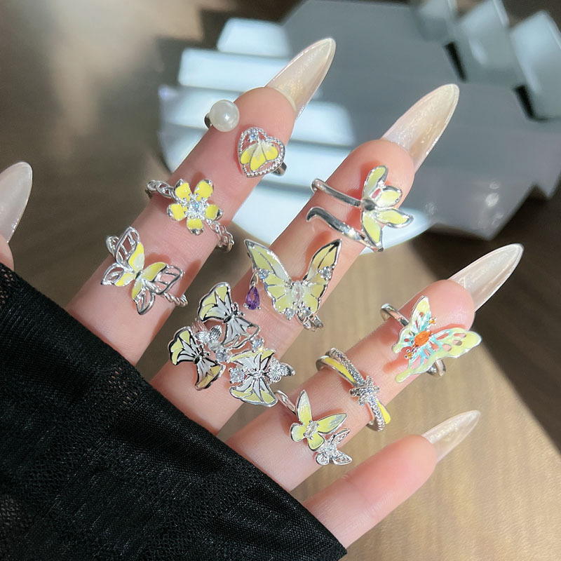 A Korean-style trendy mixed forest-themed yellow glazed butterfly flower open ring for women, with a light luxury and high-end feel full figure
