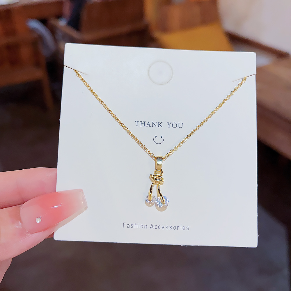 Japanese and Korean style small cherry micro-inlay zircon titanium steel necklace, feminine and individual collarbone chain, simple and niche accessory necklace Application Scenario