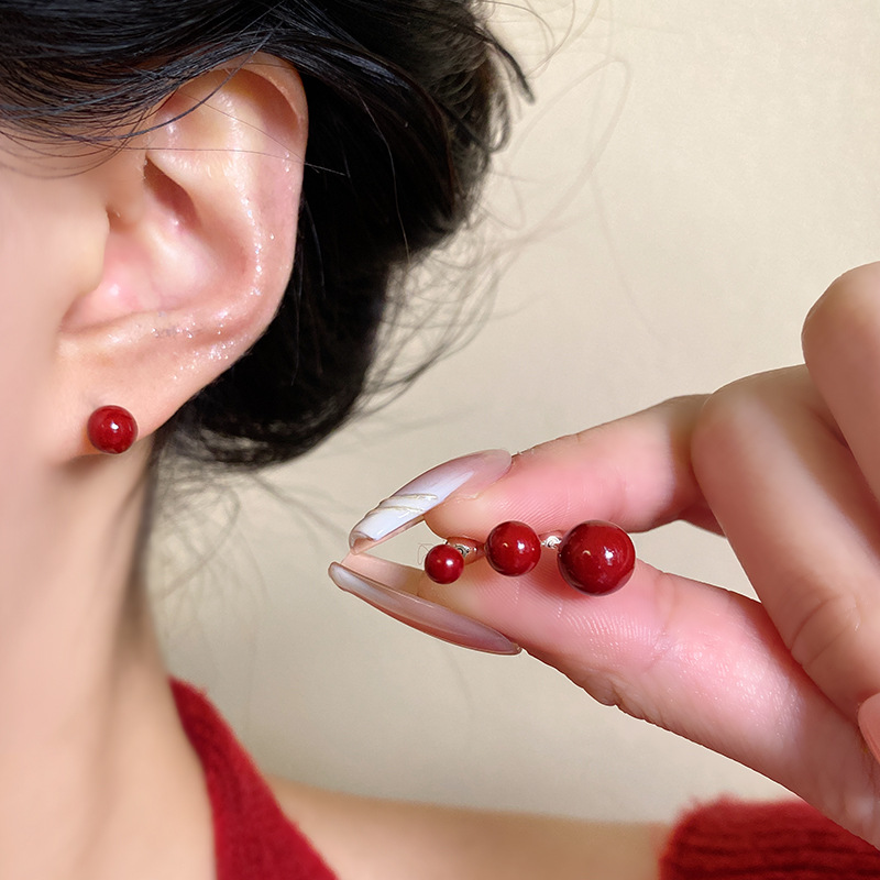 Dark red cinnabar ear studs, Korean style, fashionable and niche design, simple screw-down ear bone stud earrings wholesale details Picture