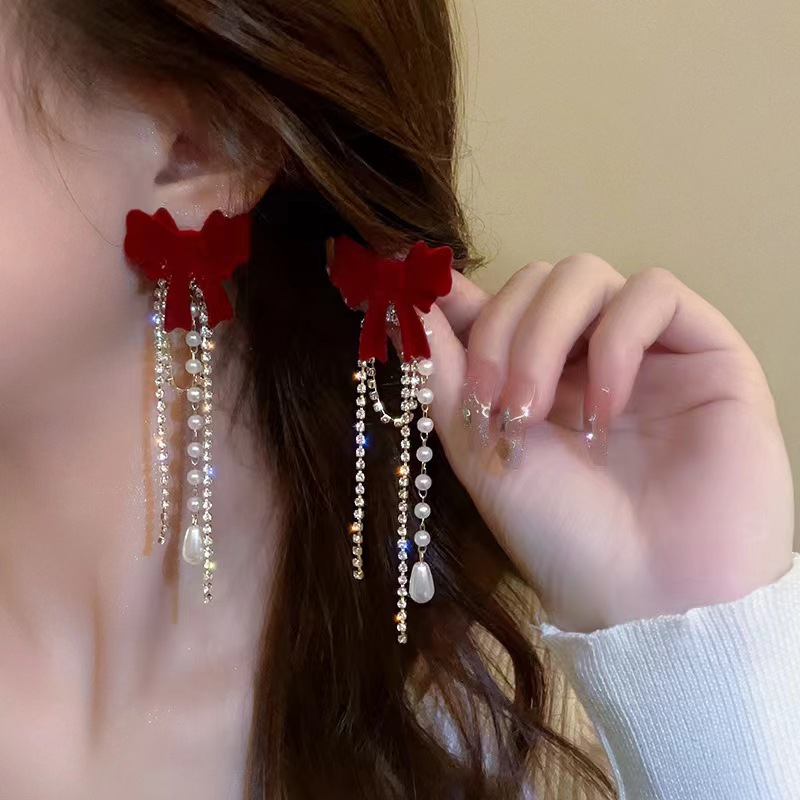 Long tassel flocked bow stud earrings for women, light luxury, fashionable, versatile, high-end and elegant ladylike earrings, a new trend full figure