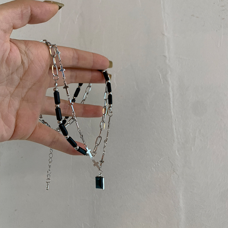 A double-layered black stone cross-shaped pendant necklace with a unique design sense for women, a collarbone chain and neck Application Scenario