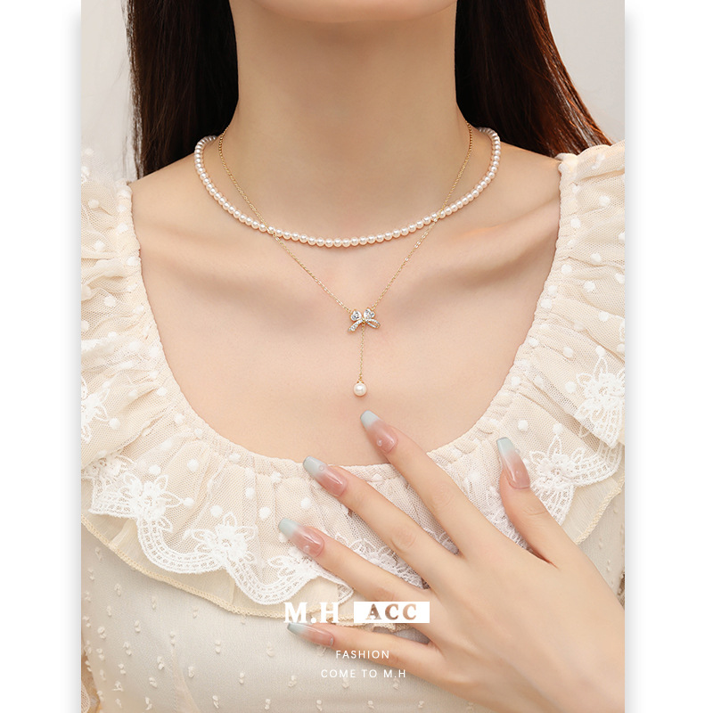 A light luxury bow zircon pearl necklace with a high-end female feel, a new Korean-style golden collarbone chain, a fashionable commuting accessory details Picture