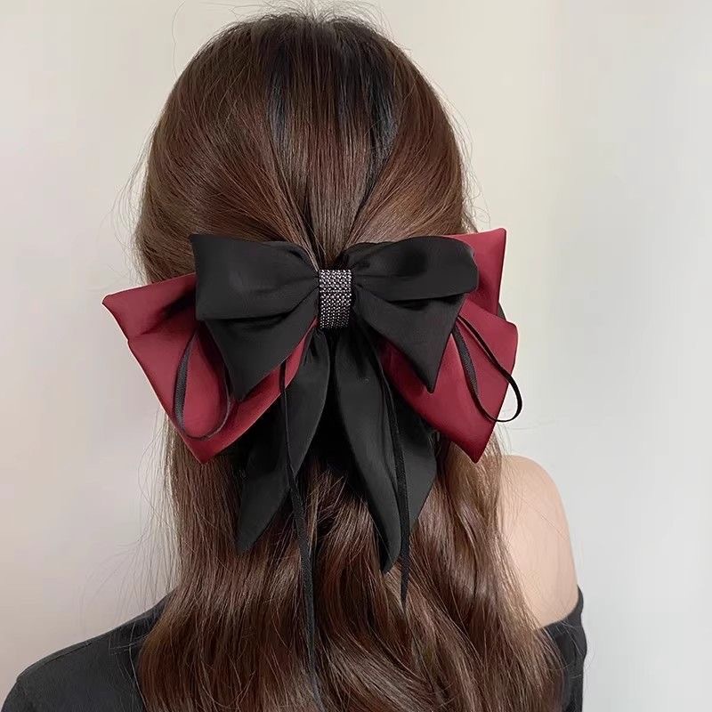 The new high-end color-blocking bow top clip is the same as the popular high ponytail grab clip and the elegant shark hair clip at the back of the head details Picture
