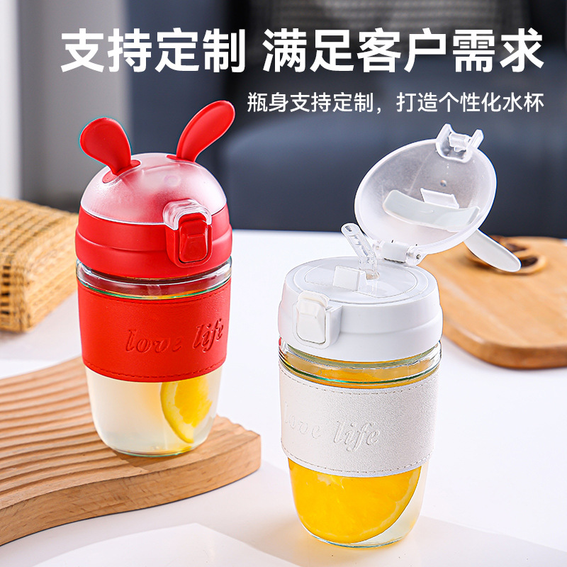 The cute rabbit glass water cup is adorable and girlish, with a high level of appearance. It is a heat-resistant straw cup that students can carry diagonally. It is a popular online cup details Picture
