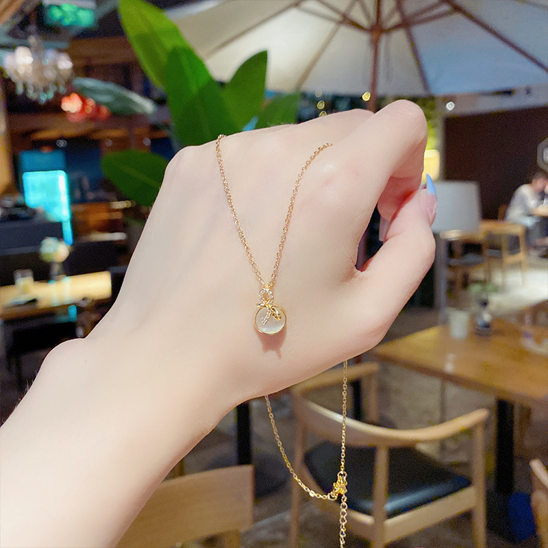 Korean internet-famous bow necklace for women, a simple and trendy titanium steel brand with a unique design sense. Wholesale of cat's eye stone collarbone chain details Picture
