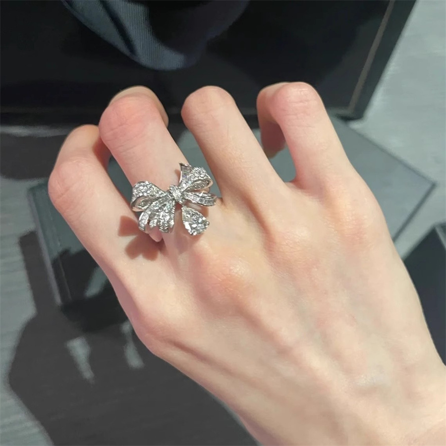 Heavy industry Super Flash Zircon bow water drop ring, a light luxury high-end niche ring for women, versatile retro index finger ring full figure