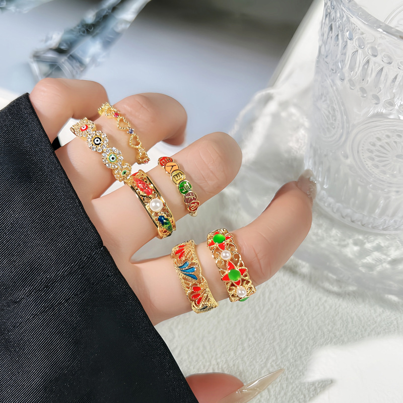 The antique Chinese trend style enamel hollowed-out fashionable geometric eye ring is adjustable, exuding a sense of high-end simplicity and versatility. It's a trendy ring full figure