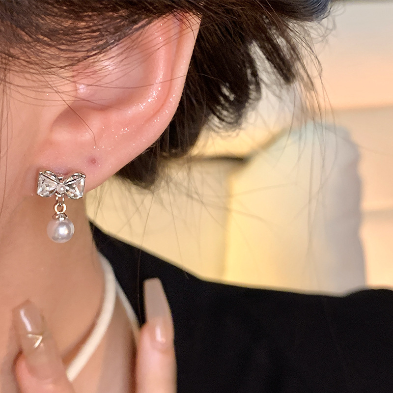 S925 Silver Needle Bow Pearl Earrings, a versatile and high-end summer trendy and popular ear accessory wholesale Application Scenario