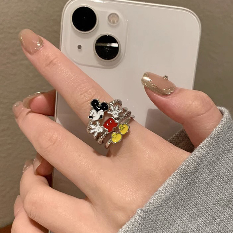 A cute Mickey Mouse ring with a childlike cartoon style. A girl student's personality is mischievous. A couple's best friend index finger ring full figure