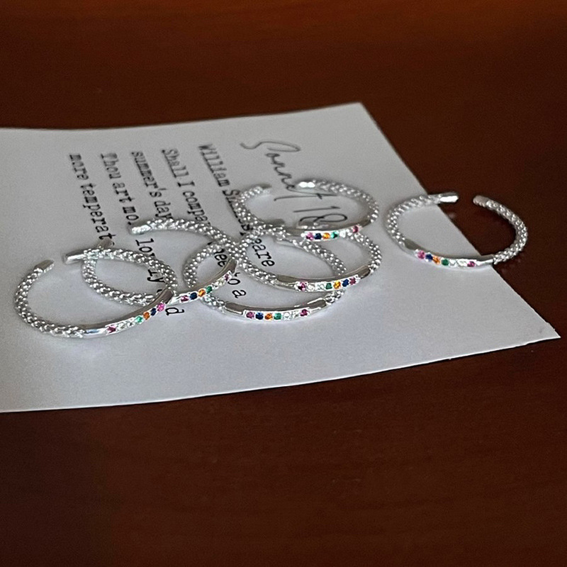 The small colored diamond zircon rainbow open ring is a unique design for women, with a high-end and individual style. It can be stacked to make the hand look slender and simple Application Scenario