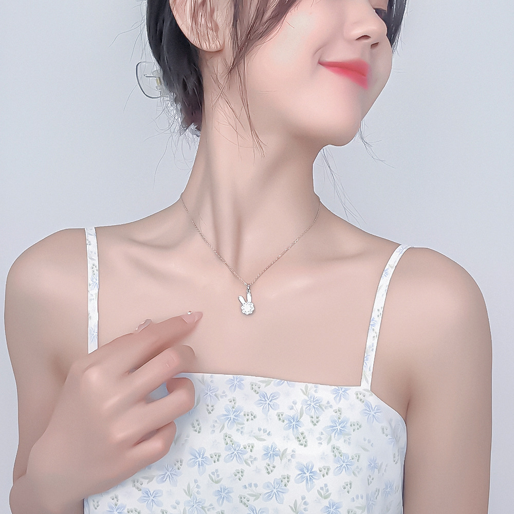 A Japanese and Korean design style rotating rabbit necklace pendant, a niche collarbone chain, a high-end and light luxury neckchain, titanium steel jewelry for women full figure