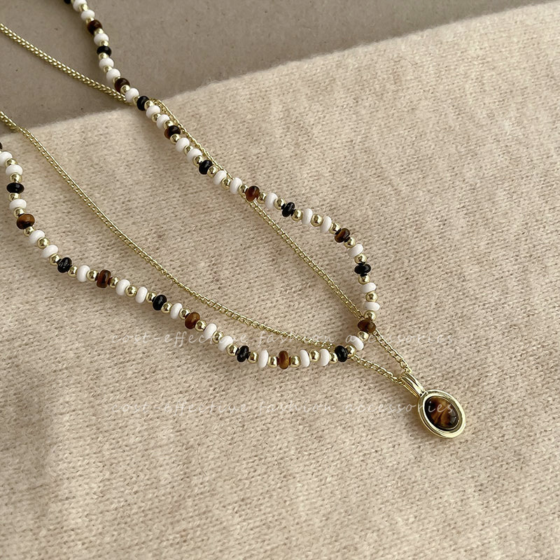 Double-layered tiger-eye pendant necklace, a new retro accessory for women, autumn and winter beaded sweater chain full figure